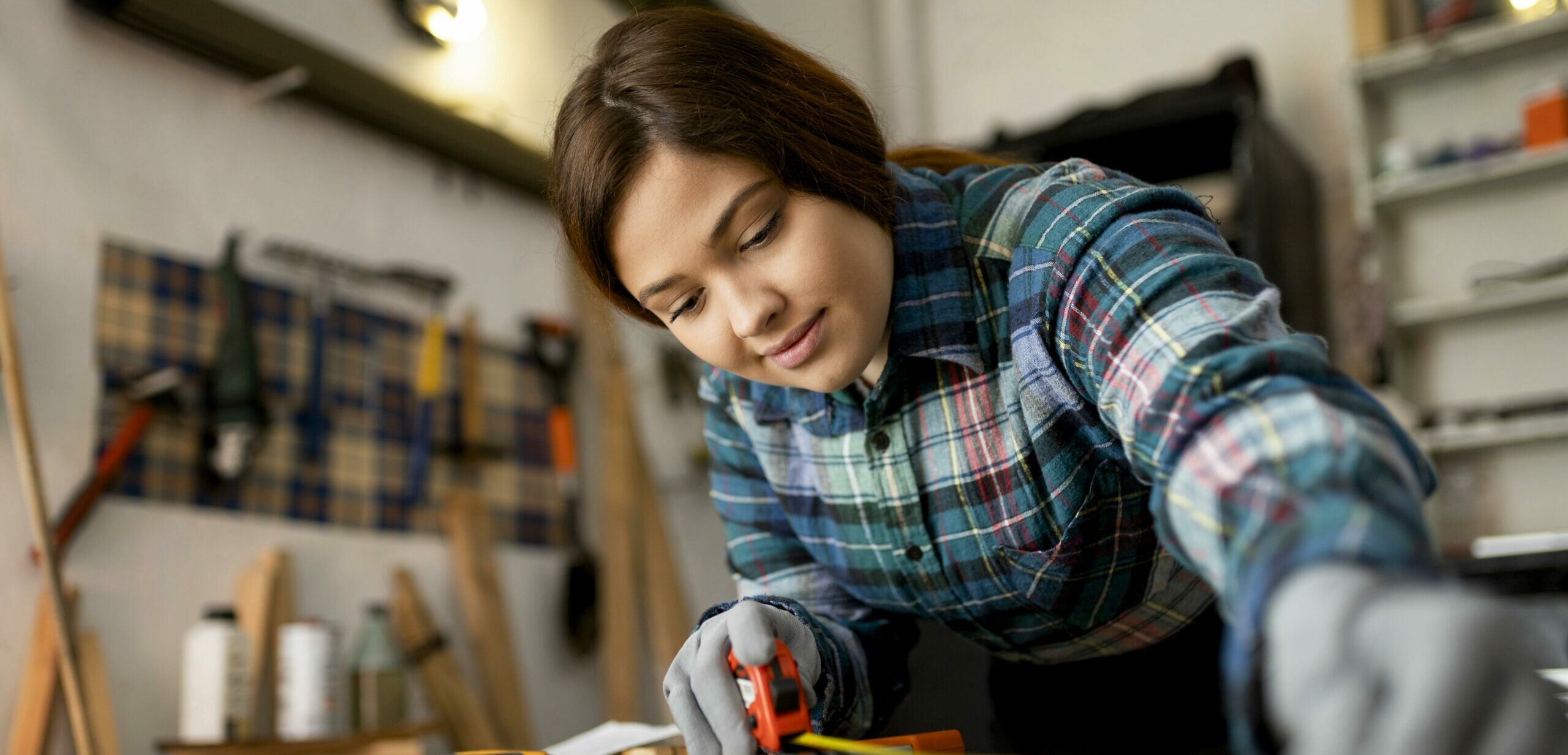 woman-working-workshop-measuring